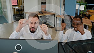 Two traders brokers celebrating successful deal at stock exchange market