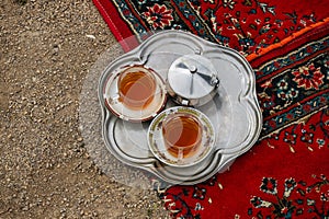 Two traditional Iranian teas with sugar.