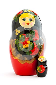 Two traditional russian matryoshka dolls on white background