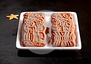 Two traditional spicy Dutch speculoos biscuits