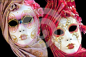 Two traditional Venetian mask on a black background photo