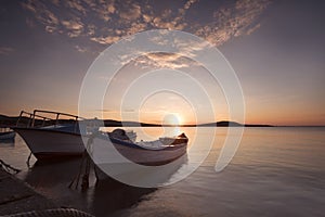 Two traditional wooden fishing boats in the sea. Fishing boats t