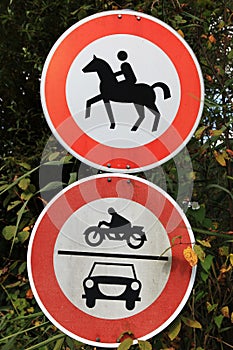 Two traffic signs for prohibition of motorcycles, cars and horse riding