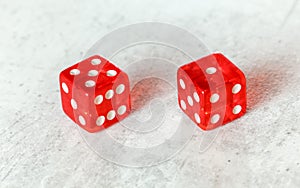 Two translucent red craps dices on white board showing Easy Six / Jimmie Hicks number 5 and 1 photo