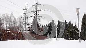 Two TRANSMISSION LINE power transmission line in a park with lanterns