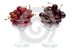 Two transparent glass bowl of ripe cherries