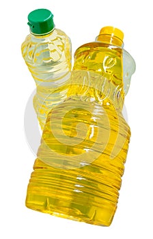 Two transparent plastic bottles of vegetable oil in palm and soybean oil in stack isolated on white background with clipping path