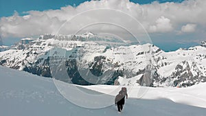 Two traveling women walking upwards on the mountain - Dolomites, Italy