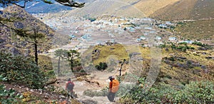 Two of trekker walk to village at Himalayas trail on the way to Everest base camp, Khumbu valley, Sagarmatha national park,