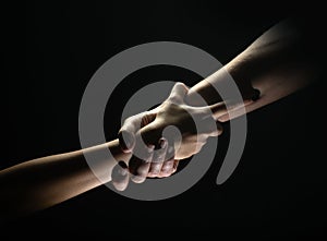 Two trength ands. Helping hand to a friend. Rescue or helping gesture of hands. Concept of salvation. Hands of two power