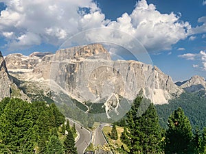 Two trucks travelling in opposite directions on a scenic mountain road