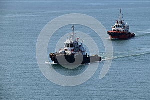 Two tugboats inside port limits area