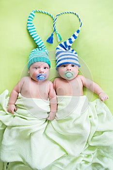 Two twins brothers babies weared in hats