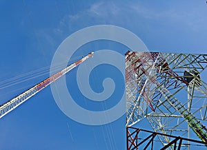 Two type of Telecommunication towers antenna on blue sky background