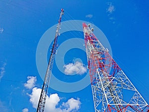 Two type of Telecommunication towers antenna on blue sky background