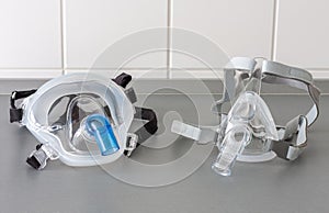 Two types of non-invasive ventilation face mask, close up view, in ICU in hospital photo
