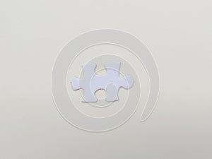 A puzzle piece on white background. Problem solving, teamwork and the integration of different elements
