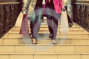 Two unrecognisable young female friends enjoying a day out shopping