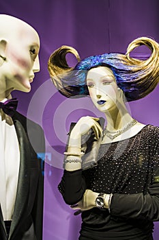 Two unusual dummies and original hairstyle. The girl with blue hair and in a black dress. Modern fashion.