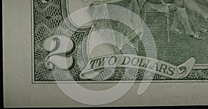 Two US dollars cash macro view. 2 cash. Under a magnifying glass.