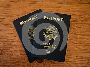 Two US Passports on a Wooden Table