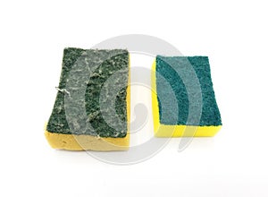 Two used and new green and yellow sponge for washing dishes isolated on white background.