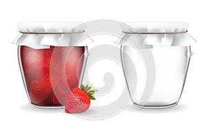 Glass jars with strawberry jam and empty