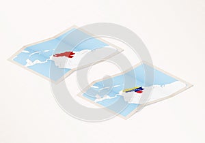 Two versions of a folded map of Venezuela with the flag of the country of Venezuela and with the red color highlighted