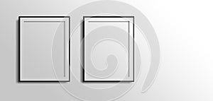 Two vertical foto frames with copy space , 3d white blank on grey wall with black borders