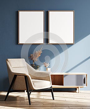 Two vertical poster frame mock up in blue living room interior with armchair and sideboard, modern living room interior background