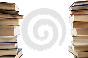 Two vertical stacks of books on a white background