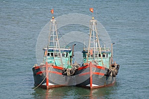 Two vietnamese fishing boats anchored together