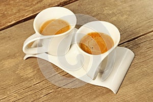 Two Vintage Cups of Espresso on Grungy Wooden Table,