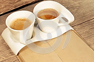 Two Vintage Cups of Espresso on Grungy Wooden Table,