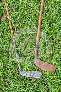 Two vintage golf clubs