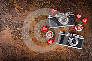 Two retro camera and hearts