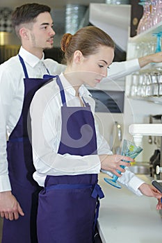 Two waiters working in cafe