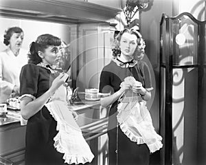 Two waitresses standing together