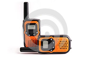 Two walkie-talkies in orange and black colors
