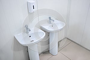 Two washbasins at the industrial plant in the sanitary room