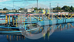 Two wastewater operators discussing a wastewater treatment station