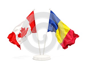 Two waving flags of Canada and romania isolated on white