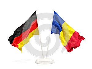 Two waving flags of Germany and romania isolated on white