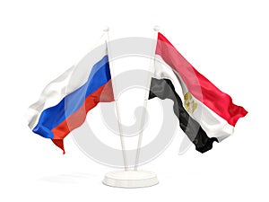 Two waving flags of Russia and egypt isolated on white