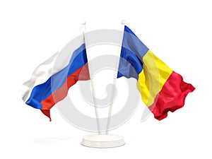 Two waving flags of Russia and romania isolated on white