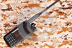 Two-way radio on camouflage background