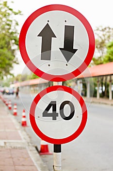 Two way sign with speed limit