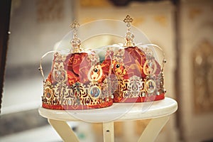 Two wedding crowns in the temple near the altar. The sacrament of wedding in the Orthodox church.