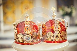 Two wedding crowns in the temple near the altar. The sacrament of wedding in the Orthodox church.