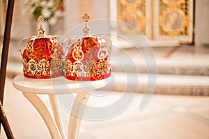 Two wedding crowns in the temple near the altar. The sacrament of wedding in the Orthodox church.